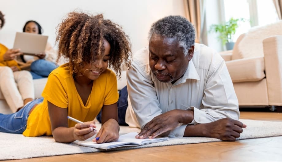Father and daughter doing a crossword together