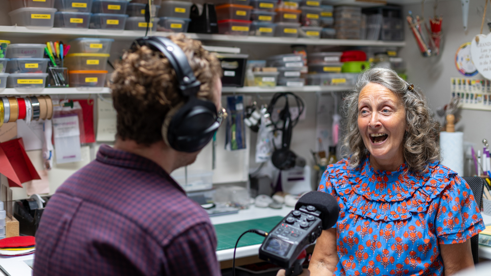 Gail being recorded for the Dementia UK podcast sitting in her art room